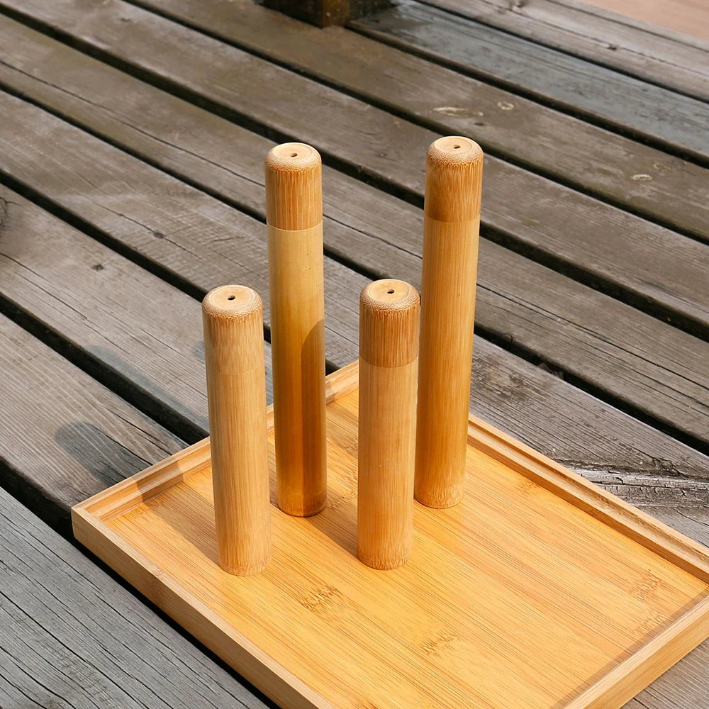 Set of bamboo utensil holders on a wooden tray