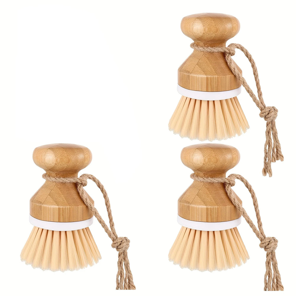 Three wooden dish brushes with natural bristles and string handles