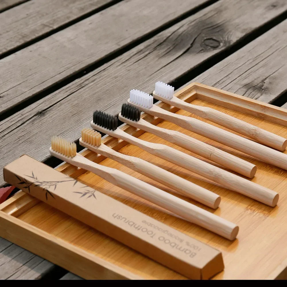 Set of bamboo toothbrushes with a wooden holder
