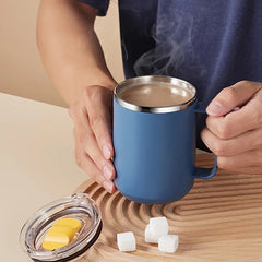 Person holding a blue Insulated Coffee Mug