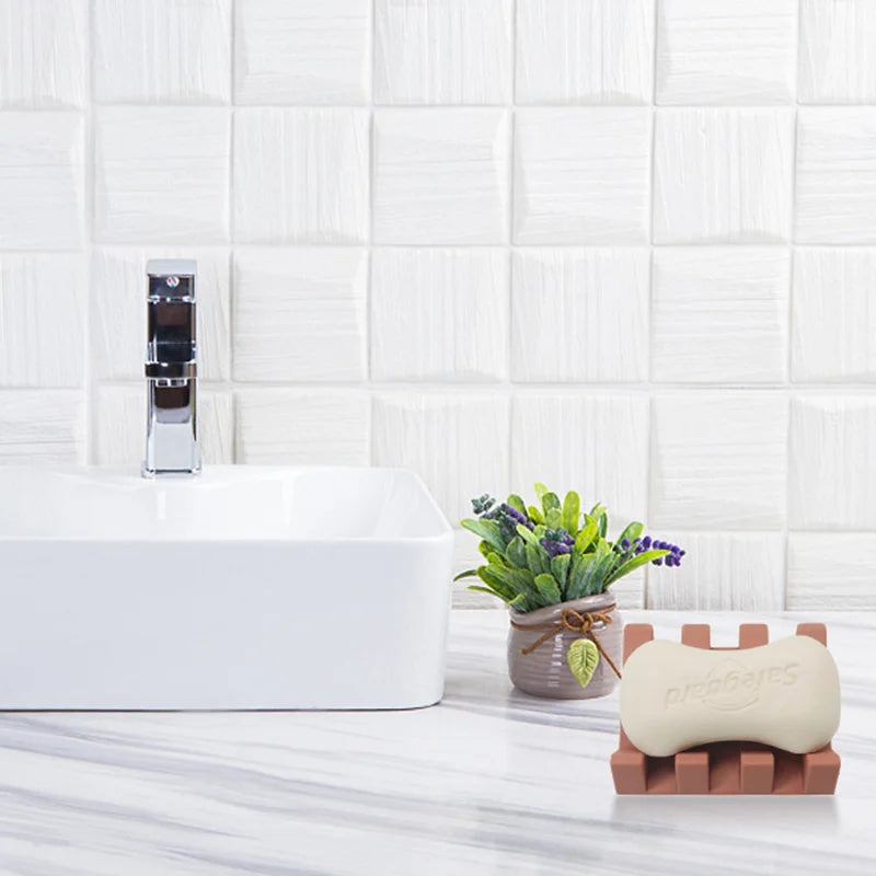 Bathroom setting with a bathtub, plant, and Silicone Soap Dish Holder