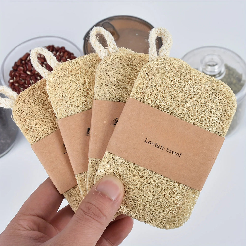 Hand holding a loofah Natural Luffa Dish Scrubber