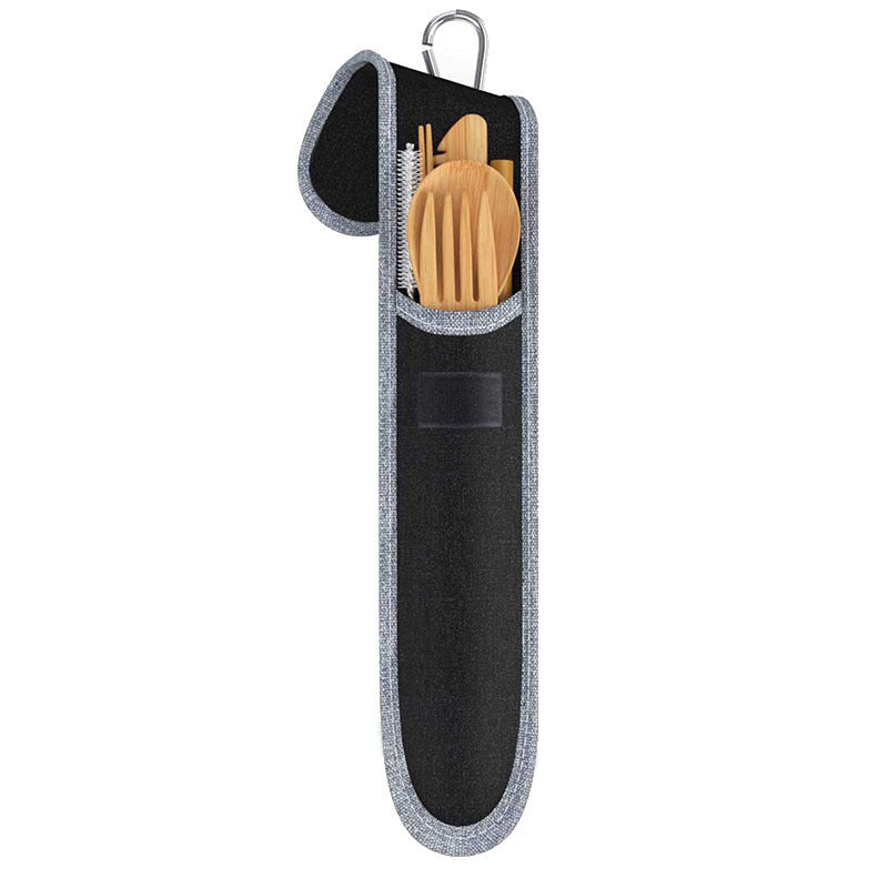 Black and gray carrying case with wooden utensils
