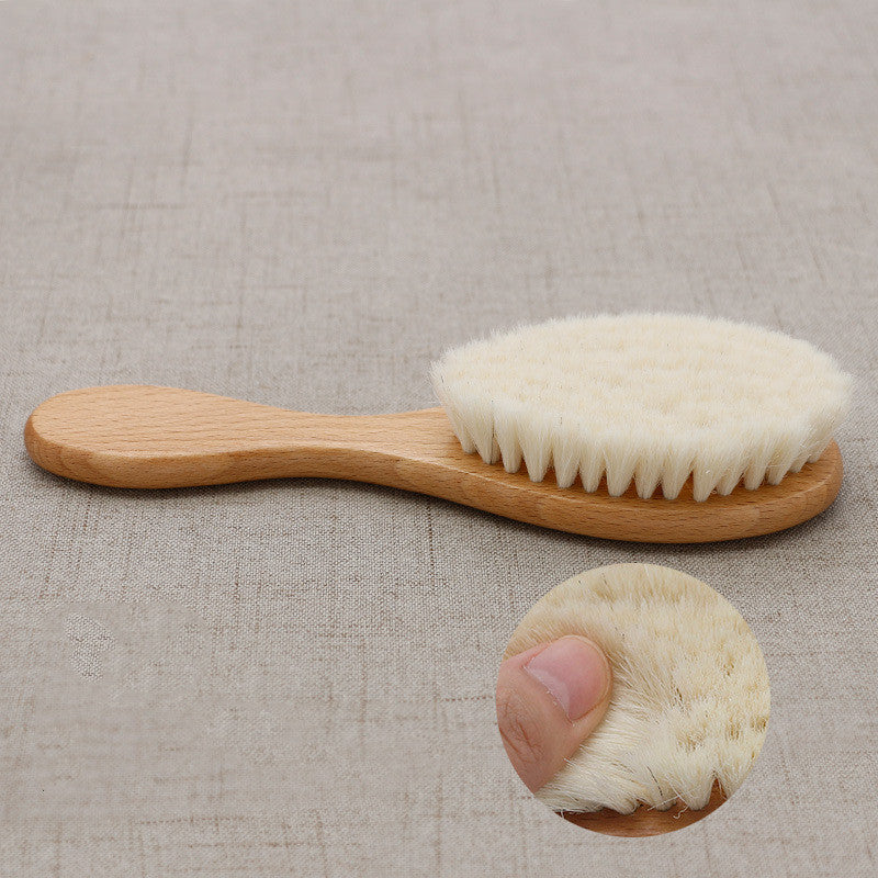 Wooden brush with white bristles on a beige fabric background